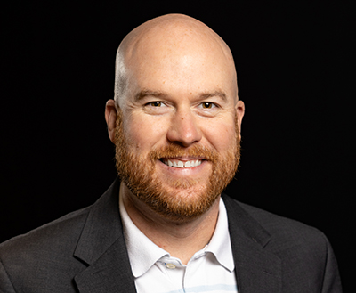 Headshot of Corey Smith.